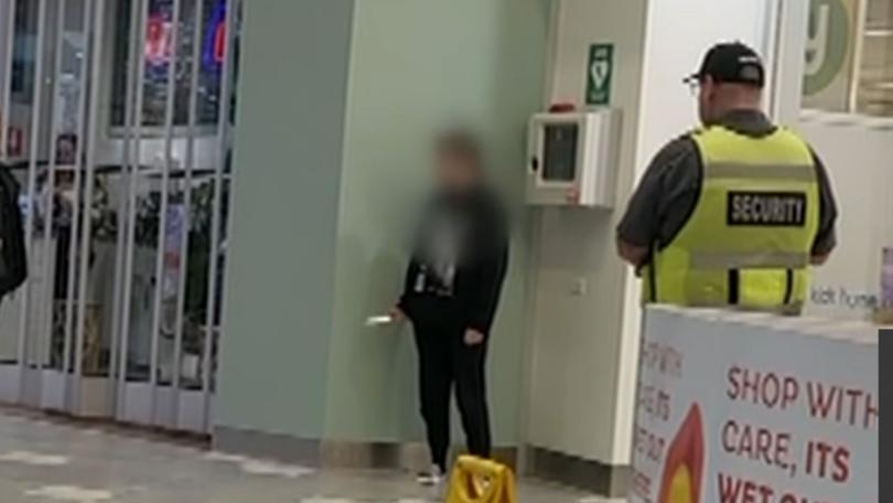 Footage of the incident shows the teenager standing in a corner of the Lake Haven shopping centre, surrounded by security.