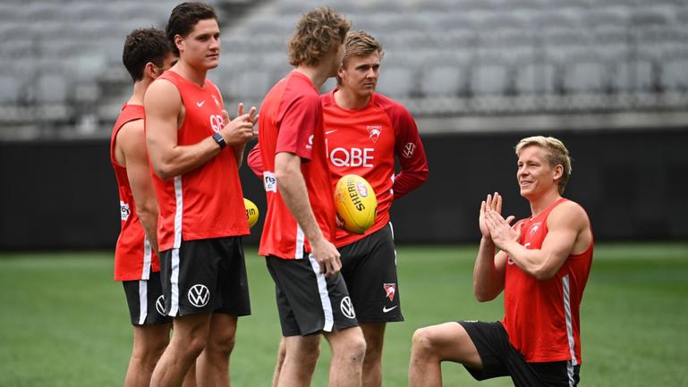 Isaac Heeney (right) with Swans teammates at training at Optus Stadium on Thursday.