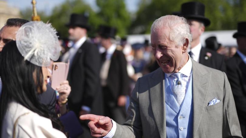 About 8000 people including the King have attended a garden party at Buckingham Palace. (AP PHOTO)