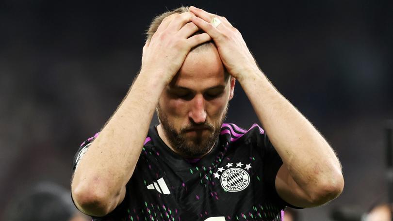 Harry Kane of Bayern Munich looks dejected after the team's defeat and elimination from the UEFA Champions League.