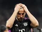 Harry Kane of Bayern Munich looks dejected after the team's defeat and elimination from the UEFA Champions League.