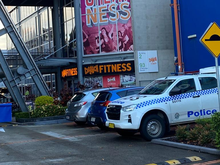 A man has been arrested after a woman was stabbed at a Crunch Fitness gym in Sydney.