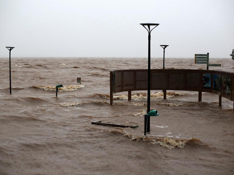 View of the flooded Lake Guaiba as a storm brews in Porto Alegre, Rio Grande do Sul state, Brazil.