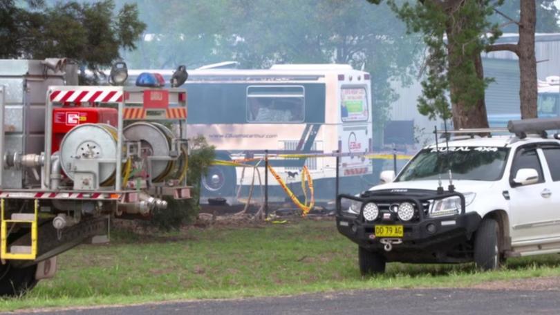A man has been charged with murder as his mother died in hospital after suffering severe burns in a NSW house fire., , Emergency services rushed to a home on Bribbaree Road, 50km northwest of Young, about midday on Sunday following reports a woman was injured in a house fire.