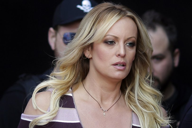 FILE - Adult film actress Stormy Daniels arrives for the opening of the adult entertainment fair Venus in Berlin, Oct. 11, 2018. A lawyer for Donald Trump said Thursday, March 30, 2023, that he has been told that the former president has been indicted in New York on charges involving payments to Daniels made during the 2016 presidential campaign to silence claims of an extramarital sexual encounter. (AP Photo/Markus Schreiber, File)