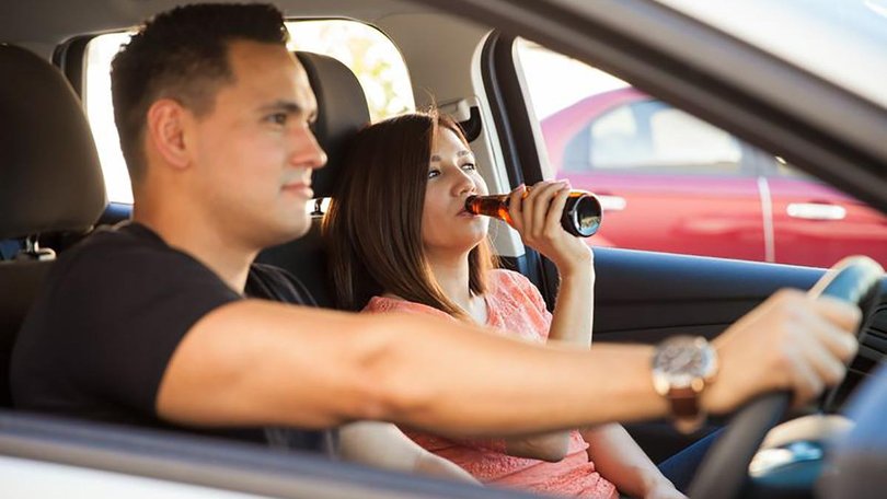 Find out if a driver can get in trouble for passengers consuming booze.