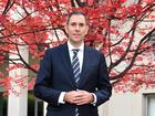 Australian Treasurer Jim Chalmers poses for photographers under the ‘budget tree’ at Parliament House in Canberra, Wednesday, May 8, 2024. (AAP Image/Lukas Coch) NO ARCHIVING LUKAS COCH