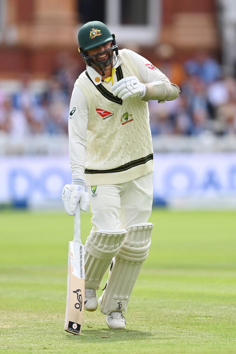 Nathan Lyon of Australia attempts to run between wickets with an injured calf.