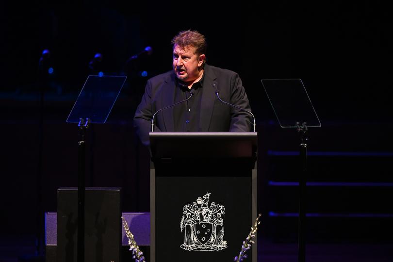 Stuart Mitchell, son of Harold Mitchell speaks during a State Memorial Service for Harold Mitchell AC at Hamer Hall, in Melbourne, Monday, May 13, 2024.