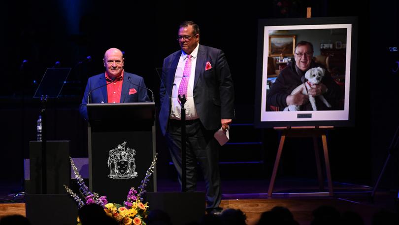 Allen Scash and Nick Swifte speak during a State Memorial Service for Harold Mitchell AC at Hamer Hall, in Melbourne, Monday, May 13, 2024.