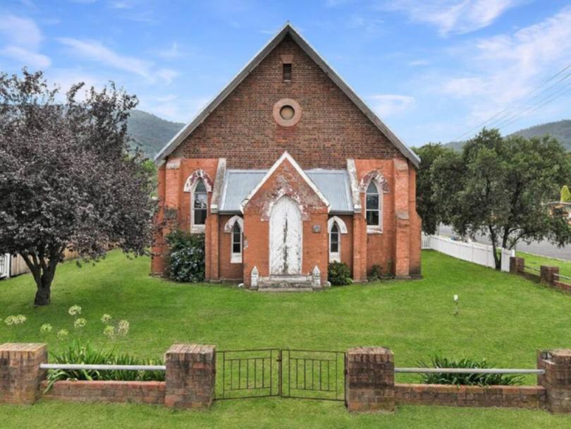 The property includes the former church building with DA approval to be converted into a four-bedroom residence.