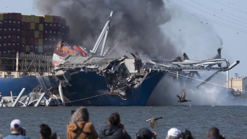 Charges have been detonated to bring down the collapsed Francis Scott Key Bridge in Baltimore. (AP PHOTO)