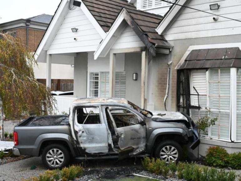 One of the burnt out cars at a house in McCracken Street, Essendon. (James Ross/AAP PHOTOS)