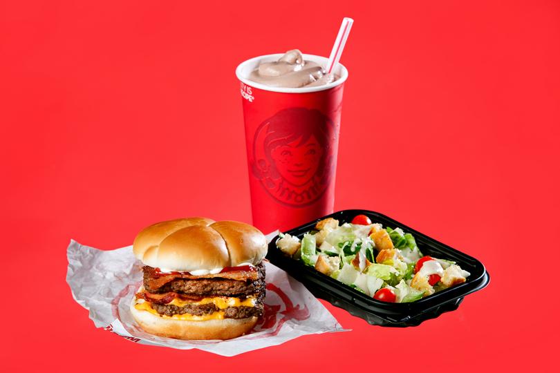 A Baconator, Frosty and side salad from Wendys, in New York.