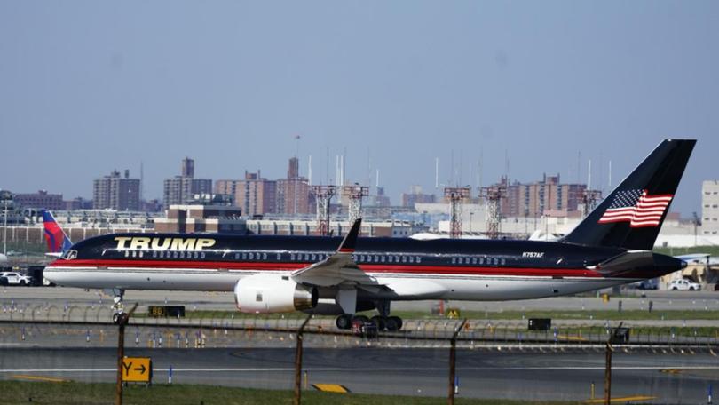 The wing of former US president Donald Trump's plane reportedly clipped another plane in Florida. (AP PHOTO)