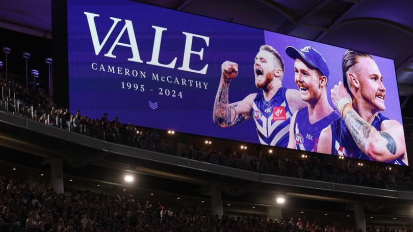 The Dockers paid tribute at Optus Stadium to former Fremantle and GWS player Cam McCarthy. (Richard Wainwright/AAP PHOTOS)