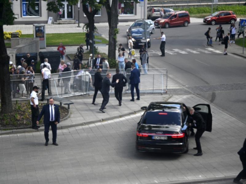 Robert Fico taken away by car