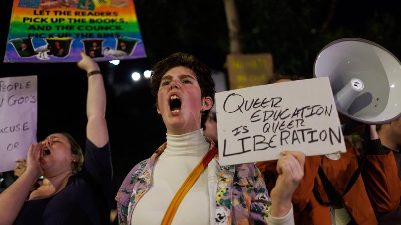 Hundreds of protesters gathered at the Cumberland Council chambers to oppose banning a book on gay parenting.