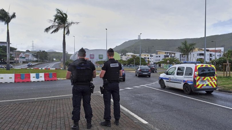 Extra French police have been sent to New Caledonia after rioters torched vehicles and businesses. (AP PHOTO)