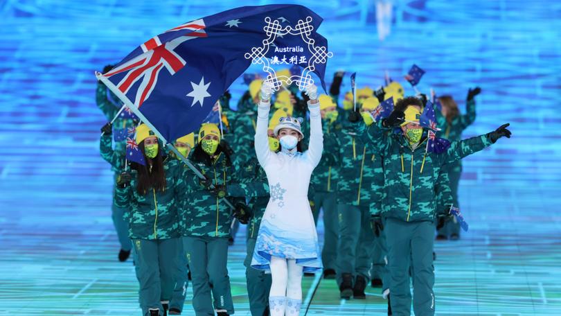 Flag bearers Brendan Kerry and Laura Peel lead the Australian team during the Opening Ceremony of the Beijing 2022 Winter Olympics.