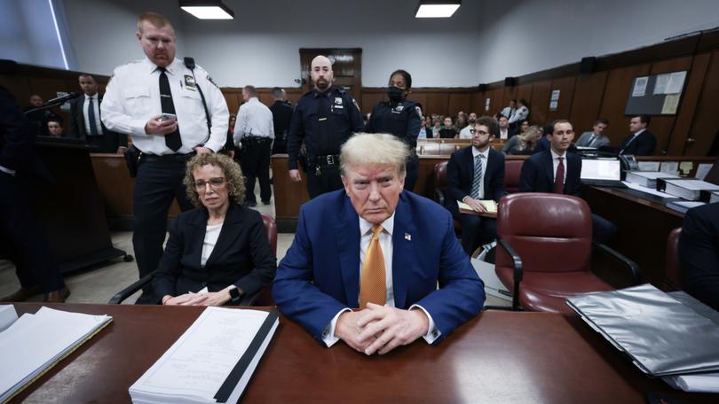 Former US president Donald Trump sits in the Manhattan criminal court.