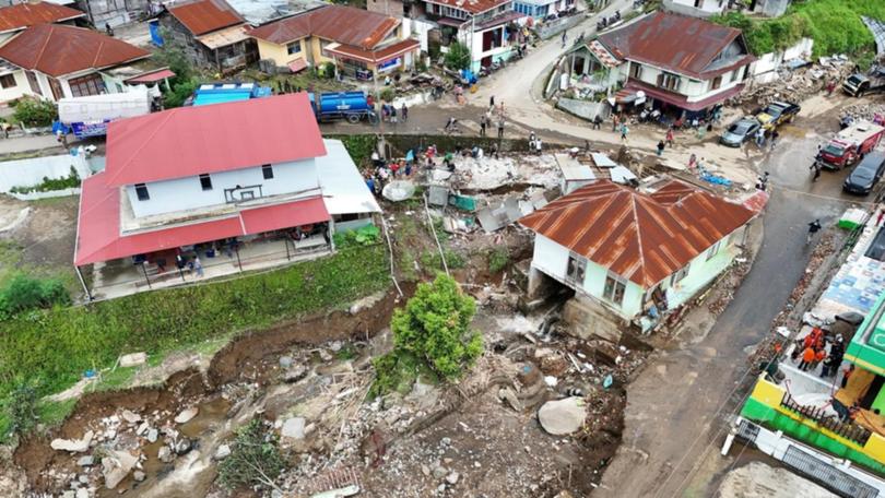 Flash flooding and landslides in West Sumatra, Indonesia, have killed almost 70 people. (EPA PHOTO)