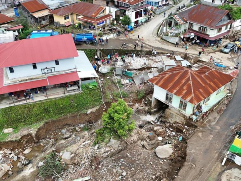 Flash flooding and landslides in West Sumatra, Indonesia, have killed almost 70 people. (EPA PHOTO)