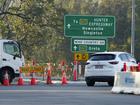 A roadblock is set up near the town of Greta following a bus crash in the Hunter Valley, north of Sydney, Australia, Monday, June 12, 2023. Australian police say that initial inquiries indicated multiple people had been killed in the overnight bus crash in New South Wales state. (AP Photo/Mark Baker)