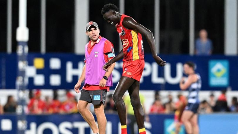 Gold Coast hope key defender Mac Andrew doesn't have a serious leg injury. (Darren England/AAP PHOTOS)