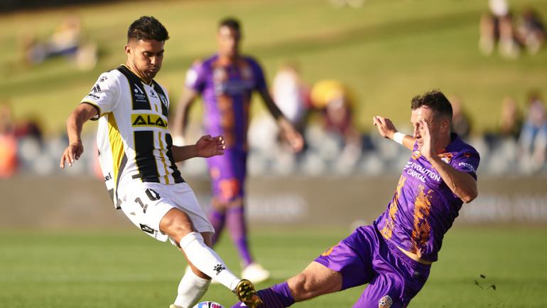 Macarthur FC captain Ulises Davila is tackled by Aaron McEneff of Glory back in 2022. This is not one of the matches allegedly affected by the betting scandal.