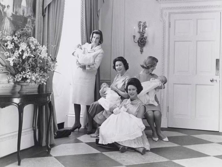 This photograph, taken by Lord Snowdon, shows Queen Elizabeth II, Princess Margaret , Princess Alexandra and the Duchess of Kent holding their newborn babies in 1964.