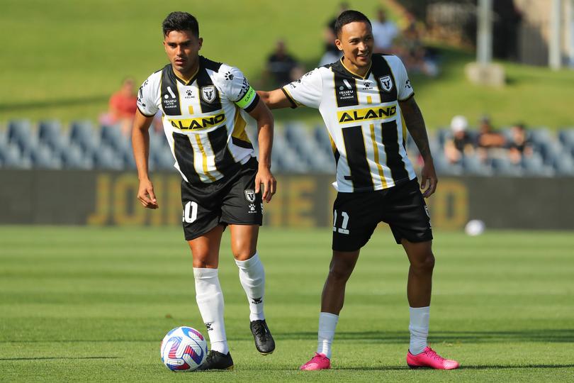 Ulises Davila and Kearyn Baccus in action for Macarthur FC.
