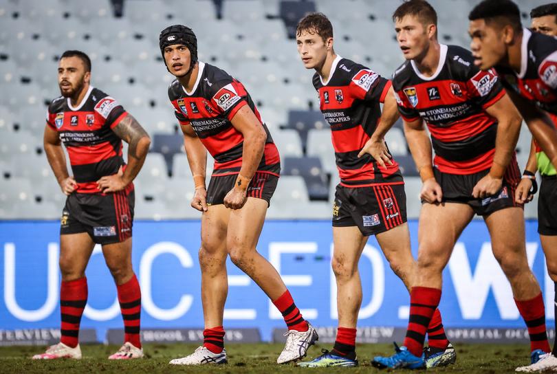 Joseph Suaalii (2nd L) of the North Sydney Bears stands with team mate Sam Walker (C) and team mates during the Rugby League NSW Cup round 2 match between the Western Suburbs Magpies and North Sydney Bears at Campbeltown Stadium in Campbelltown, NSW, Sunday, March 21, 2021. (AAP Image/David Gray) NO ARCHIVING, EDITORIAL USE ONLY