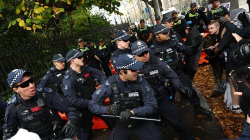 Police have clashed with protesters in front of Victoria's parliament. (Con Chronis/AAP PHOTOS)