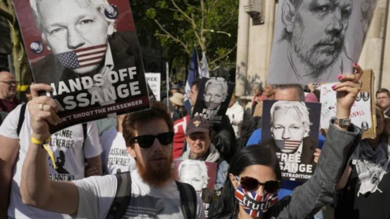 Supporters chanted "Free, free Julian Assange" as they protested outside London's High Court.