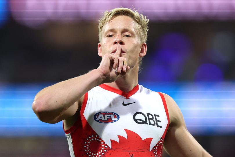 Isaac Heeney celebrates kicking a goal on Friday night.