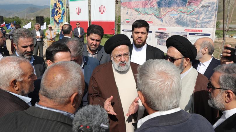 Iranian President Ebrahim Raisi visiting the site of a proposed road and rail bridge project over the Aras River, following a meeting with Azerbaijani President Ilham Aliyev. His helicopter crashed shortly afterwards, killing Mr Raisi and his foreign minister.