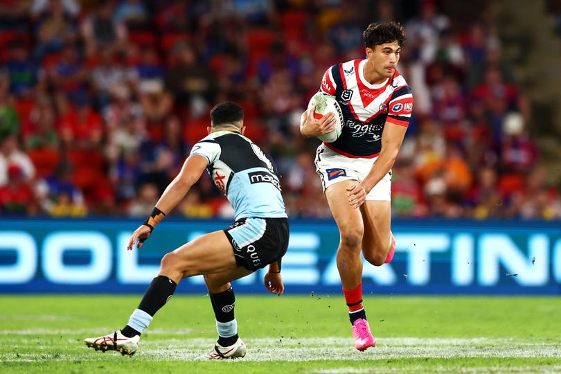 BRISBANE, AUSTRALIA - MAY 18: Joseph-Aukuso Suaalii of the Roosters runs the ball  during the round 11 NRL match between Cronulla Sharks and Sydney Roosters at Suncorp Stadium, on May 18, 2024, in Brisbane, Australia. (Photo by Chris Hyde/Getty Images)