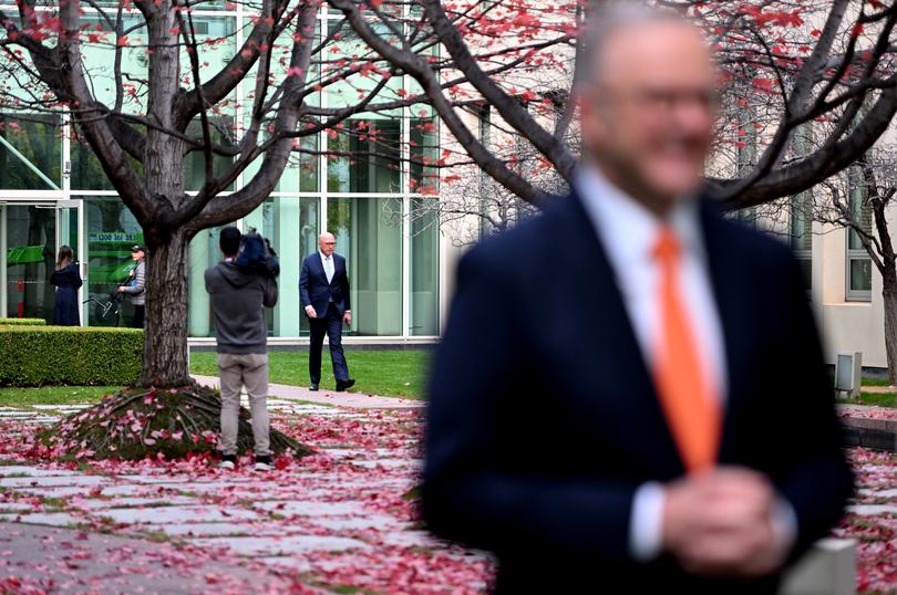 CANBERRA, AUSTRALIA - MAY 15: Opposition Leader Peter Dutton arrives and walks behind Prime Minister of Australia, Anthony Albanese during post budget media interviews at Parliament House on May 15, 2024 in Canberra, Australia. Australia's Labor government is grappling with a slowing economy, weaker commodity prices, soaring housing costs and a softening labor market. It unveiled its federal budget on May 14. The budget is seen as a key opportunity for the Labor government to deliver broad economic support that analysts say is fundamental to re-election chances next year. (Photo by Tracey Nearmy/Getty Images)