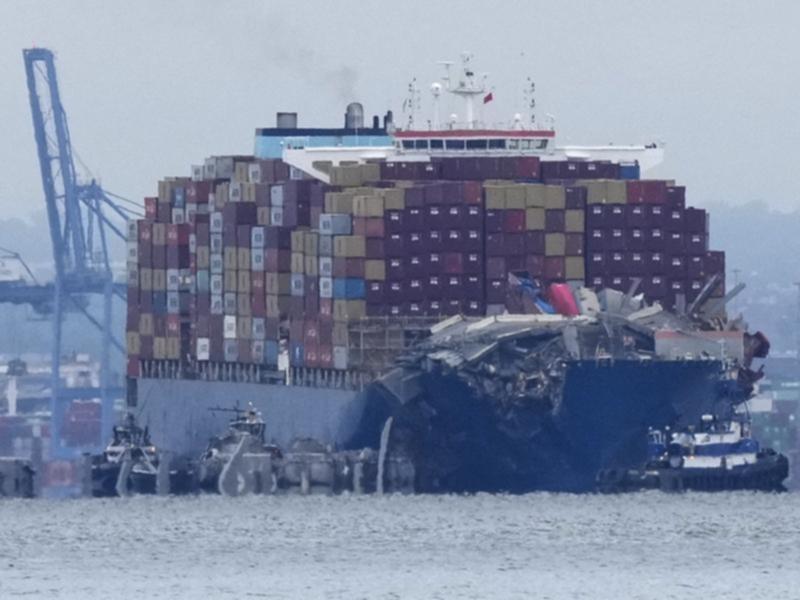 Crews work to move the cargo ship Dali in Baltimore, Monday