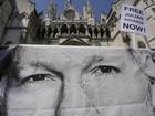 A poster of Julian Assange is left by protesters outside the High Court in London. (AP PHOTO)