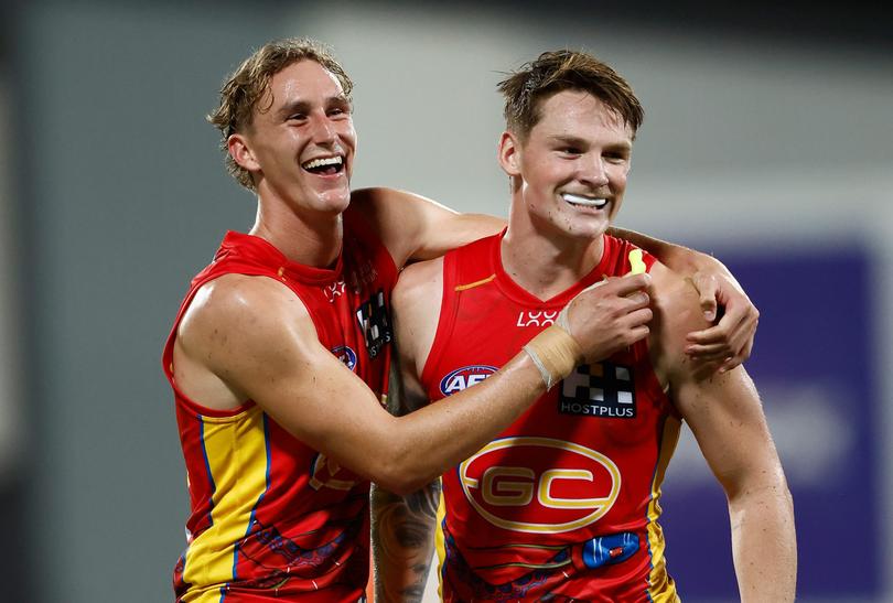 DARWIN, AUSTRALIA - MAY 16: Sam Clohesy (left) and Bailey Humphrey of the Suns celebrate during the 2024 AFL Round 10 match between The Gold Coast SUNS and The Geelong Cats at TIO Stadium on May 16, 2024 in Darwin, Australia. (Photo by Michael Willson/AFL Photos via Getty Images)
