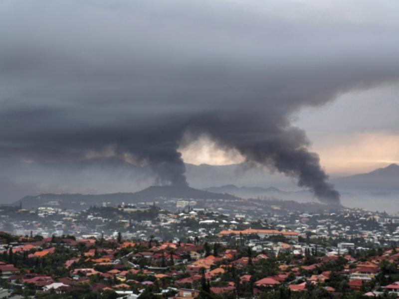Smoke rises during protests in Noumea, New Caledonia