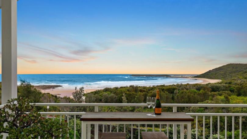 37 Surfside Drive in Catherine Hill Bay is listed with a guide of $4.8 million to $5.1 million with Nick Clarke and Taylah Clarke at Clarke and Co Estate Agents. The view from the balcony