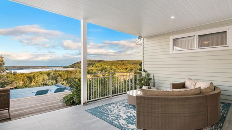 37 Surfside Drive in Catherine Hill Bay is listed with a guide of $4.8 million to $5.1 million with Nick Clarke and Taylah Clarke at Clarke and Co Estate Agents. The alfresco area overlooks the pool.