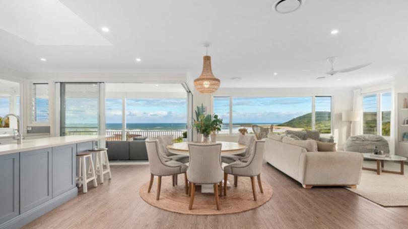 37 Surfside Drive in Catherine Hill Bay is listed with a guide of $4.8 million to $5.1 million with Nick Clarke and Taylah Clarke at Clarke and Co Estate Agents. The house was designed to capture the ocean view.