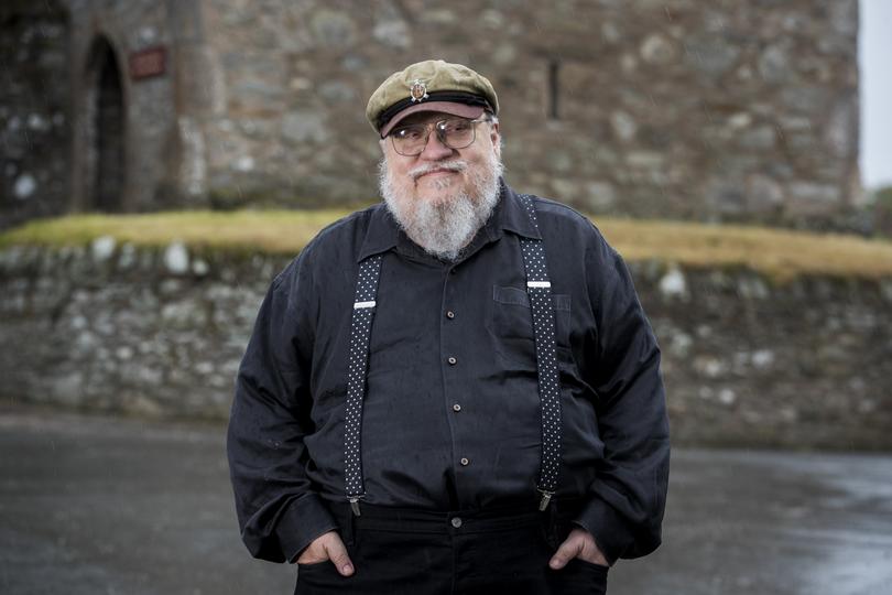 George R. R. Martin, American novelist and short story writer, best known for his series of epic fantasy novels, A Song of Ice and Fire, which was adapted into the HBO series Game of Thrones stands at fictional Winterfell Castle in the grounds of the National Trust property, Castle Ward, where scenes from the series were filmed, before an audience with George at Castle Ward's theatre this evening. (Photo by Liam McBurney/PA Images via Getty Images)