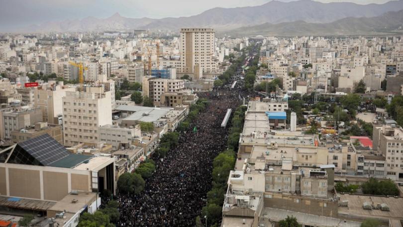 The streets of Mashhad have been packed with people for the funeral of late president Ebrahim Raisi. (EPA PHOTO)