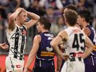 Billy Frampton of the Magpies reacts a free kick is awarded to Sean Darcy.