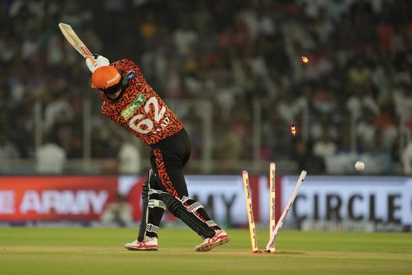 Sunrisers Hyderabad's Travis Head is bowled out by Kolkata Knight Riders' Mitchell Starc.